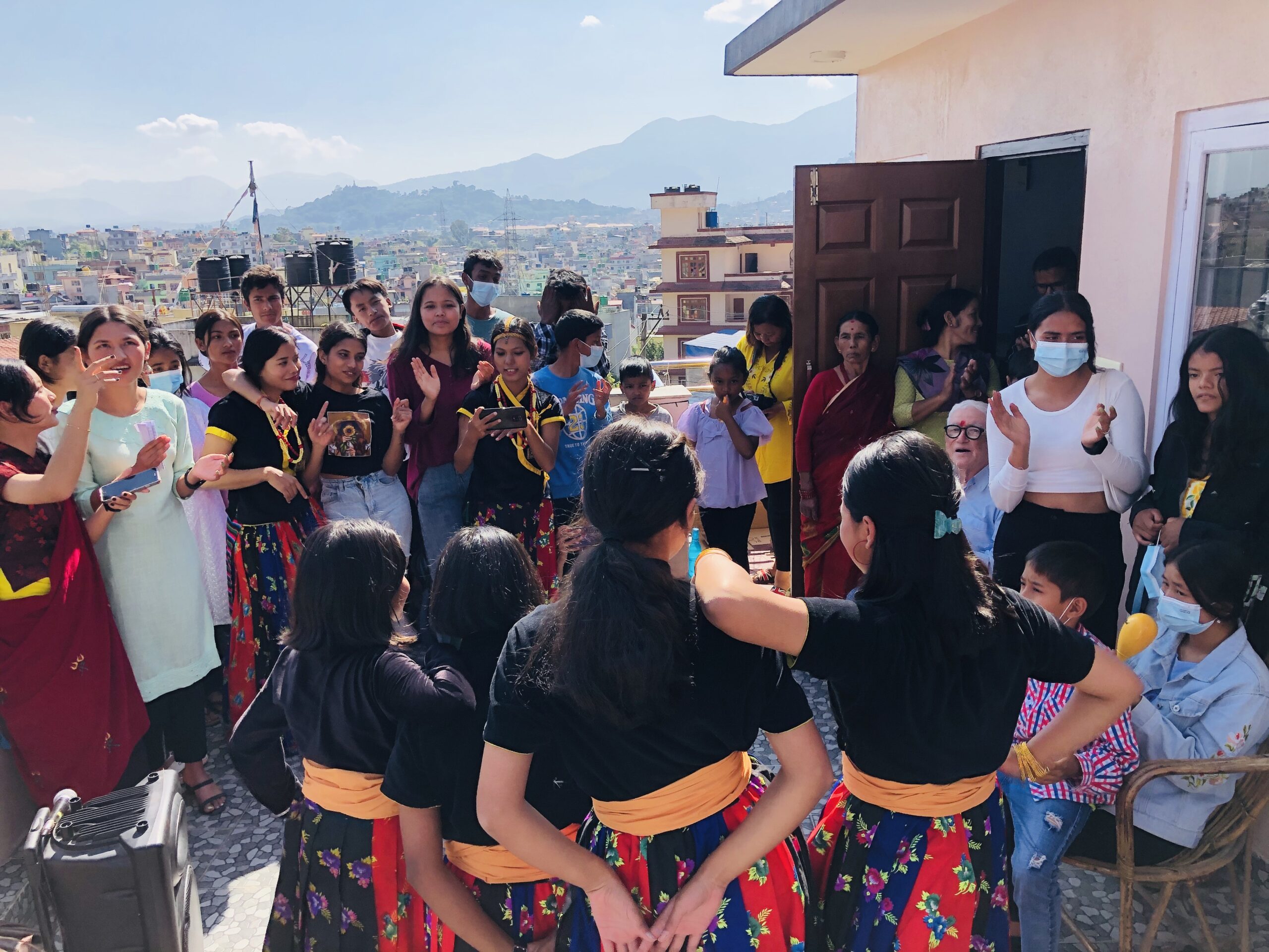 Over 20 Olgapuri kids participate in the Deusi-Bhailo outside a staff member's house. Everyone's smiling and clapping along -- so much fun during this festival season!